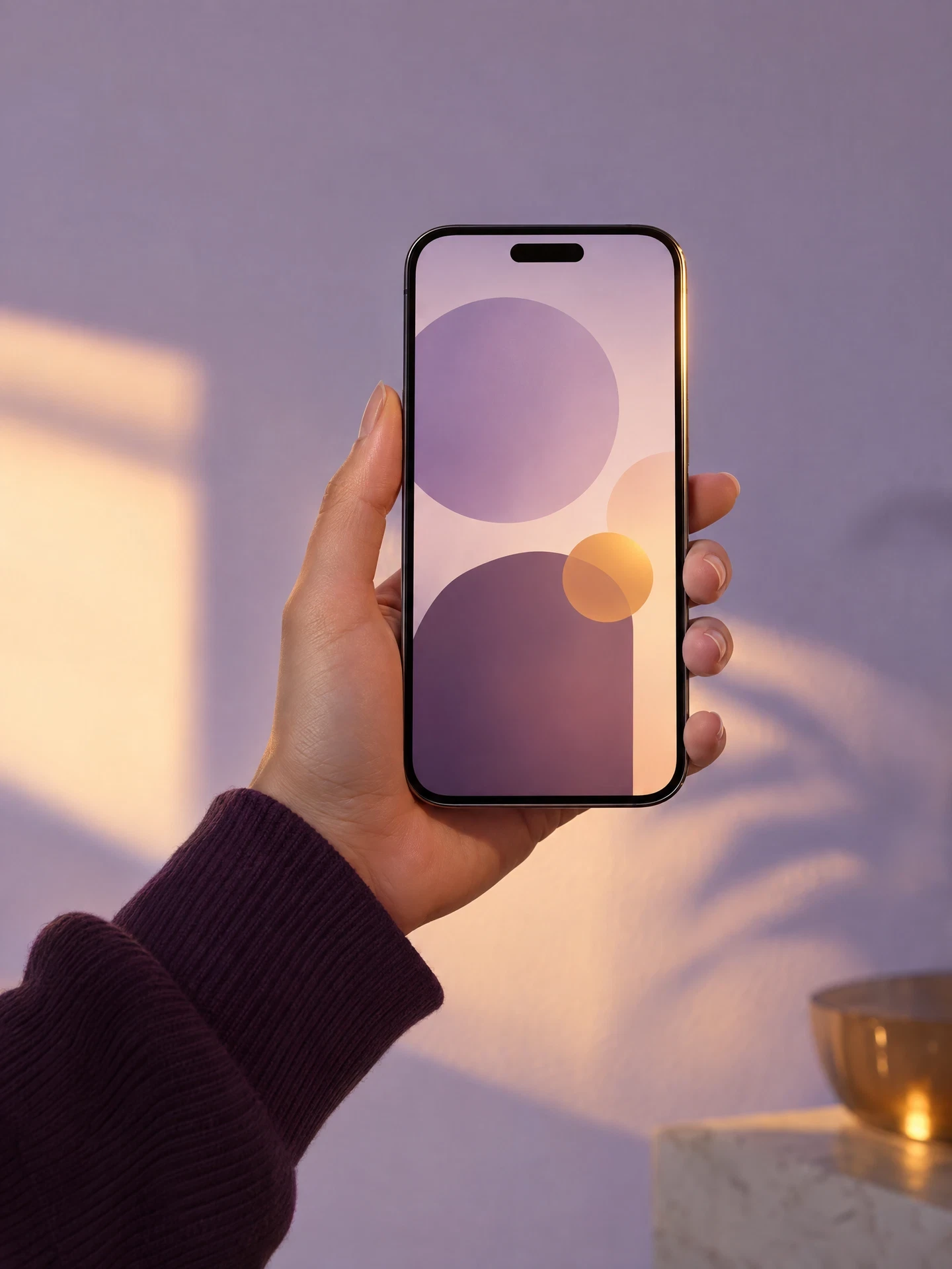 Hand holding an unbranded mobile prototype with abstract screen shapes