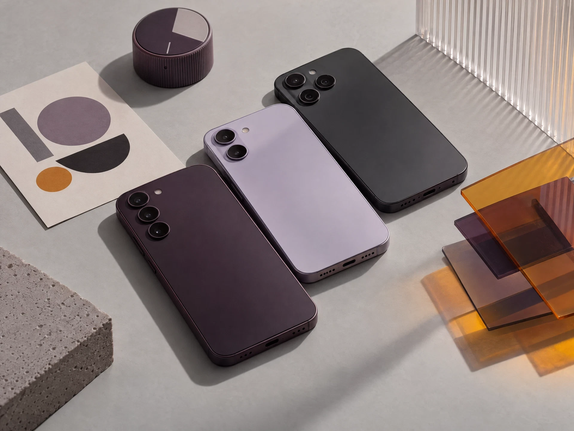 Unbranded phone prototypes and abstract testing materials on a studio table